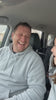AI-generated staged scene: a dad laughing then crying in the car